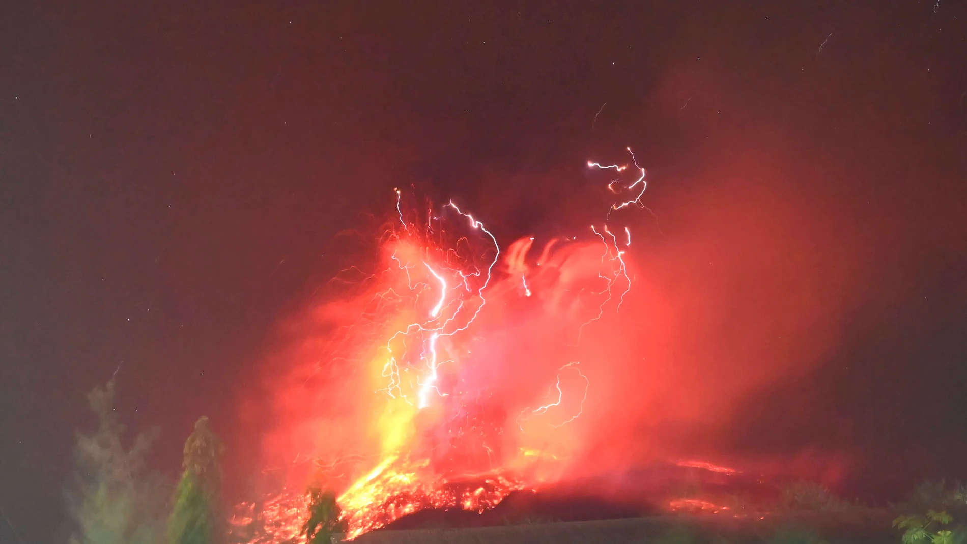 In this photo released by Geological Agency (Badan Geologi) of the Indonesia's Ministry of Energy and Mineral Resources, lava glows on the slope of Mount Lewotobi Laki-Laki during an eruption in East Flores, Indonesia, Saturday, Aug. 2, 2025. (Badan Geologi via AP)