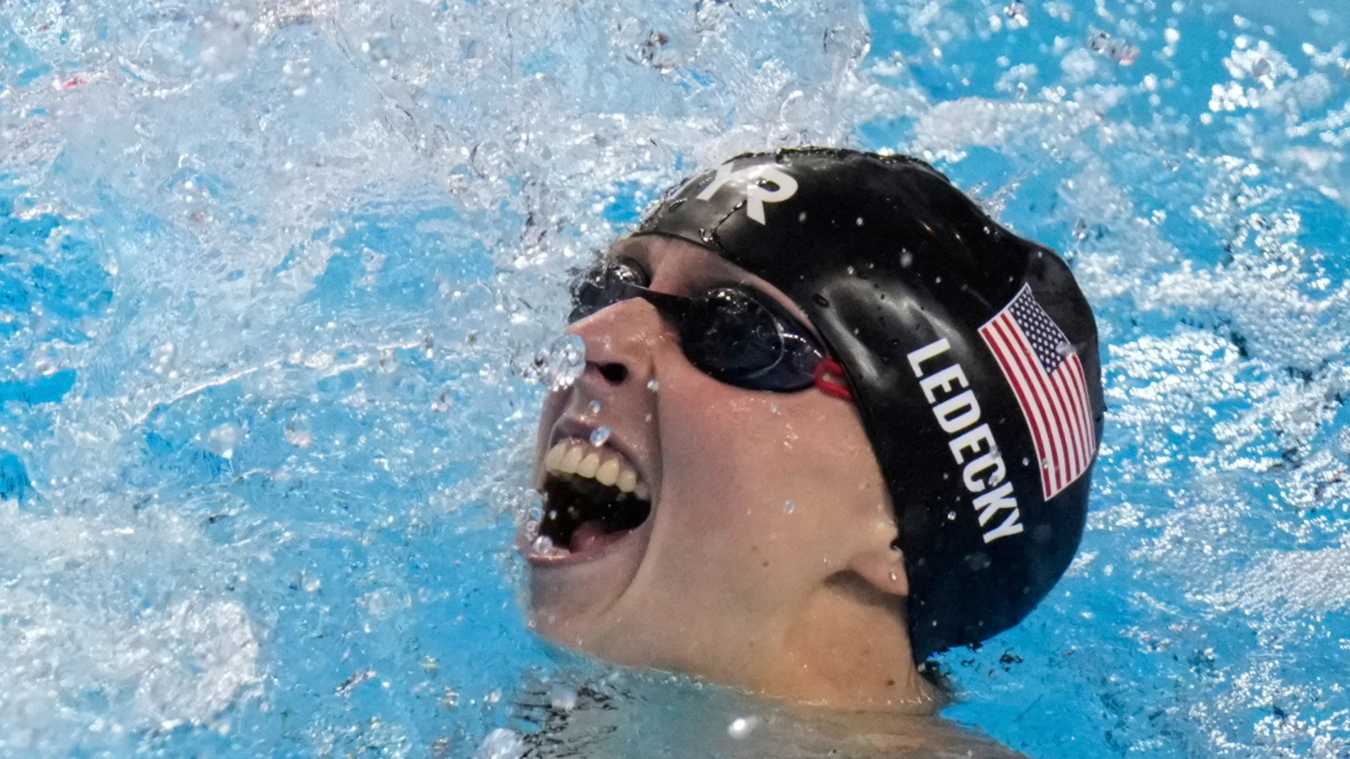 Katie Ledecky of the United States celebrates after winning gold medal in the women's 800-meter freestyle final at the World Aquatics Championships in Singapore, Saturday, Aug. 2, 2025. (AP Photo/Lee Jin-man)