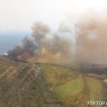 Cádiz.-Sucesos.- Evacuan un camping en Tarifa por un incendio declarado en el paraje La Peña