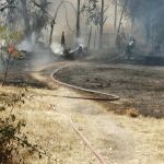 MADRID.-Sucesos.- Extinguido un incendio declarado en una parcela de Collado Villalba que se salda con un bombero intoxicado