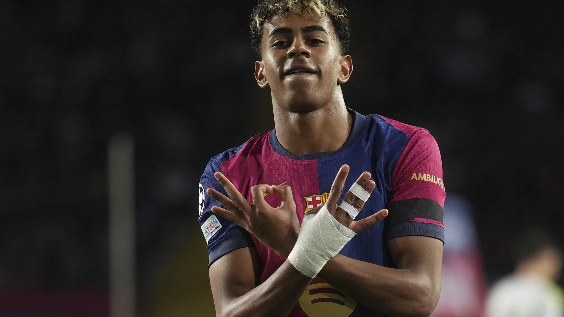 FILE - Barcelona's Lamine Yamal celebrates after scoring his side's second goal during the Champions League round of 16 second leg soccer match between FC Barcelona and SL Benfica at the Lluis Companys Olympic Stadium in Barcelona, Spain, Tuesday, March 11, 2025. (AP Photo/Emilio Morenatti, File)