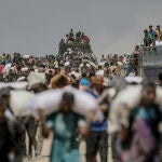 Palestinians pick up food at distribution point