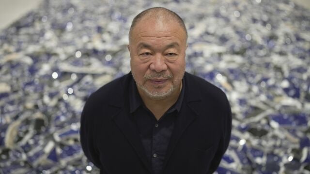 Dissident Chinese artist and activist Ai Weiwei poses for a photograph at his exhibition "Making Sense" at the Design Museum, in London, Tuesday, April 4, 2023. 
