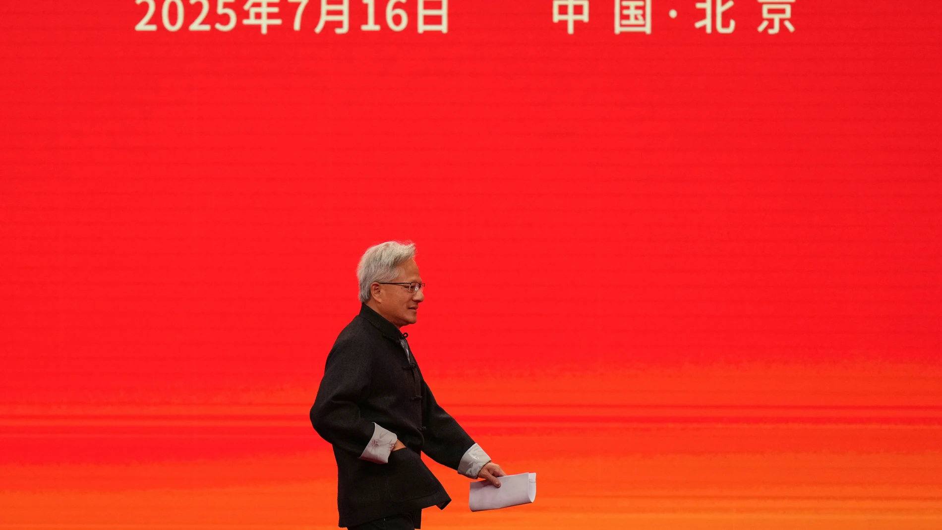 President and CEO of Nvidia Corporation Jensen Huang heads to deliver his speech for the opening ceremony of the 3rd China International Supply Chain Expo in Beijing, Wednesday, July 16, 2025.