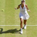 Garbiñe celebra el triunfo en la semifinal de Wimbledon ante Radwanska