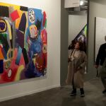Varias personas observan la obra 'Running Man' (2017) del artista griego Jannis Varelas expuesto por la Galería Krinzinger en la Feria Internacional de Arte Contemporáneo ARCO 2018