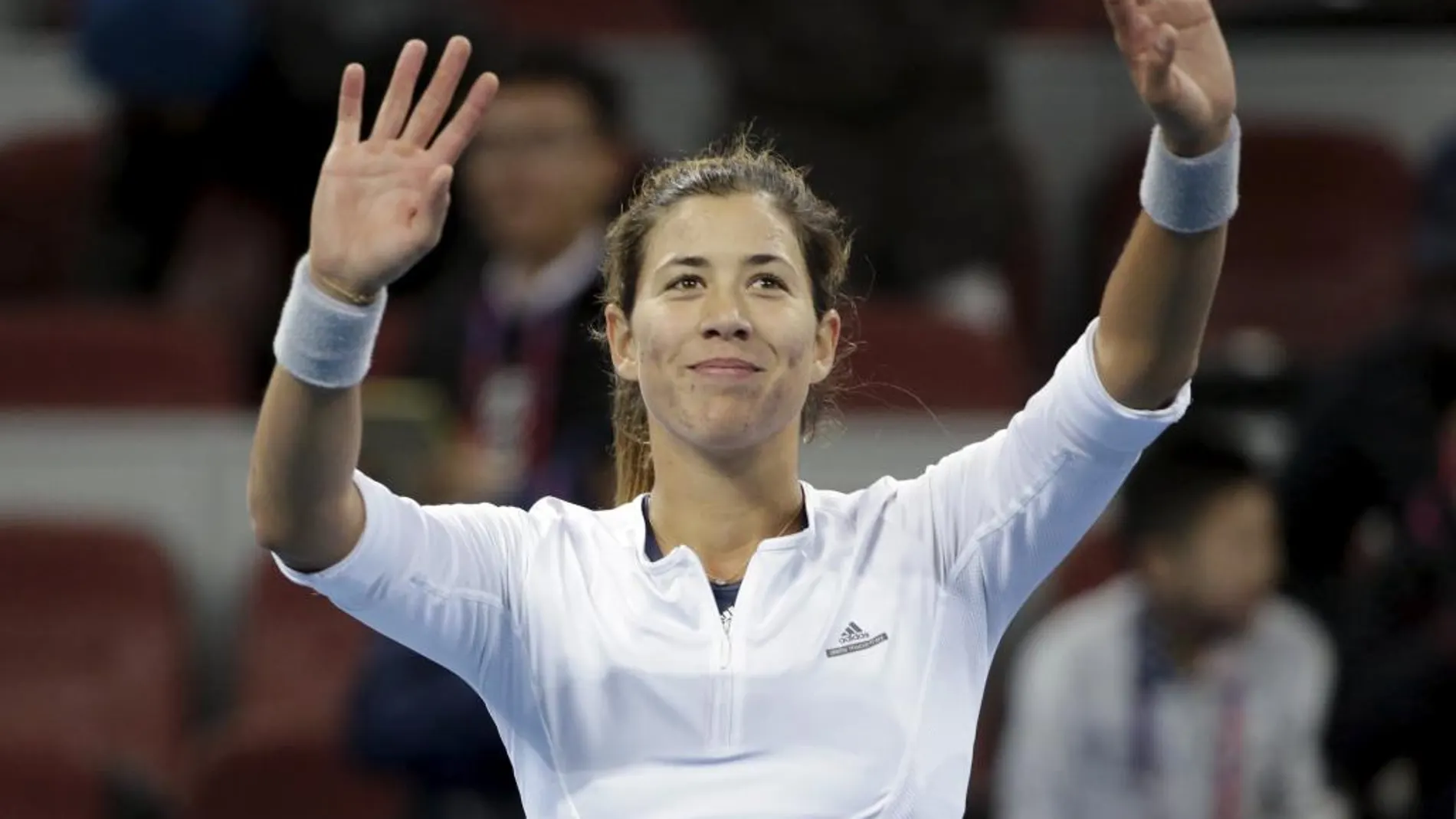 Garbiñe Muguruza celebra su triunfo ante la polaca Agnieszka Radwanska