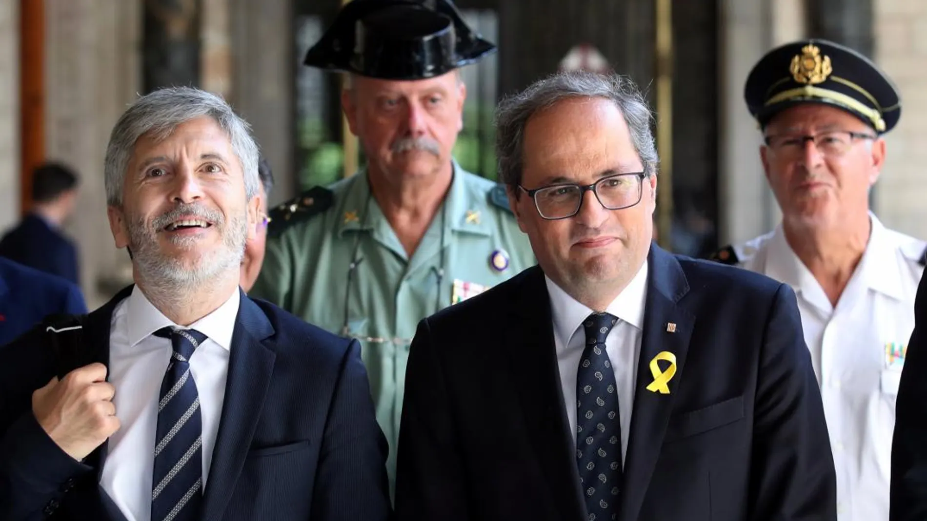 El presidente de la Generalitat,Quim Torra, junto al ministro de Interior, Fernando Grande-Marlaska. Foto. Efe