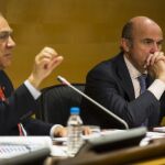 El Director General de la OCDE, Ángel Gurria y del Ministro de Economia, Luis de Guindos.
