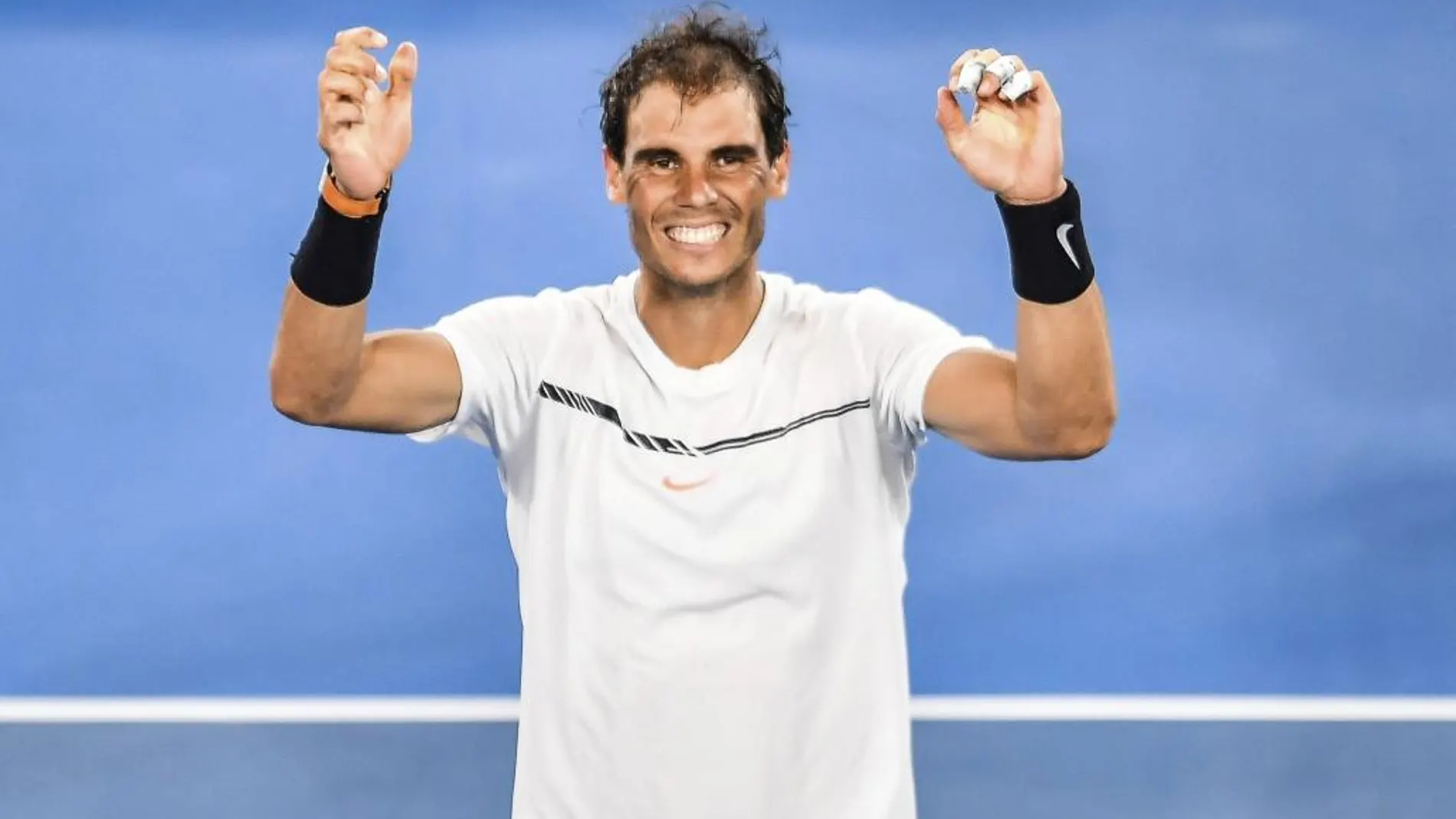 El tenista español Rafael Nadal reacciona tras su victoria en la semifinal del Abierto de Australia