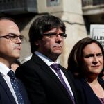 Ada Colau, Carles Puigdemont y Jordi Turull .