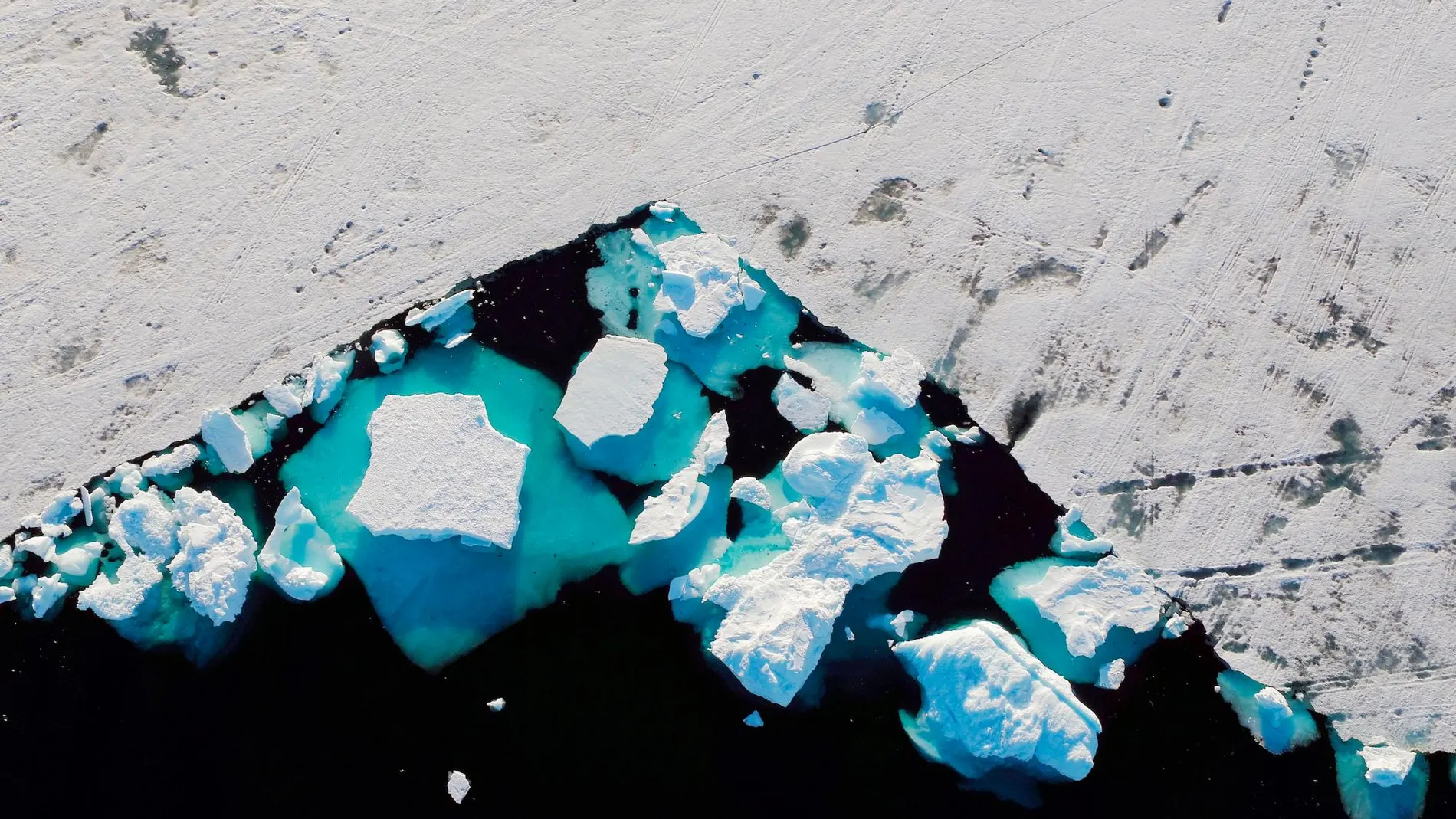 Un trozo de hielo de Groenlandia desgajándose, el pasado mes de julio / Reuters