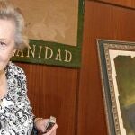 María de los Ángeles Infante, junto a un retrato del "padre de la patria andaluza"