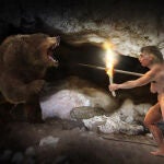 Recreación artística de una mujer neandertal (en 1968 en Lezetxiki se encontró el humero entero de una neandertal) y un oso de las cavernas