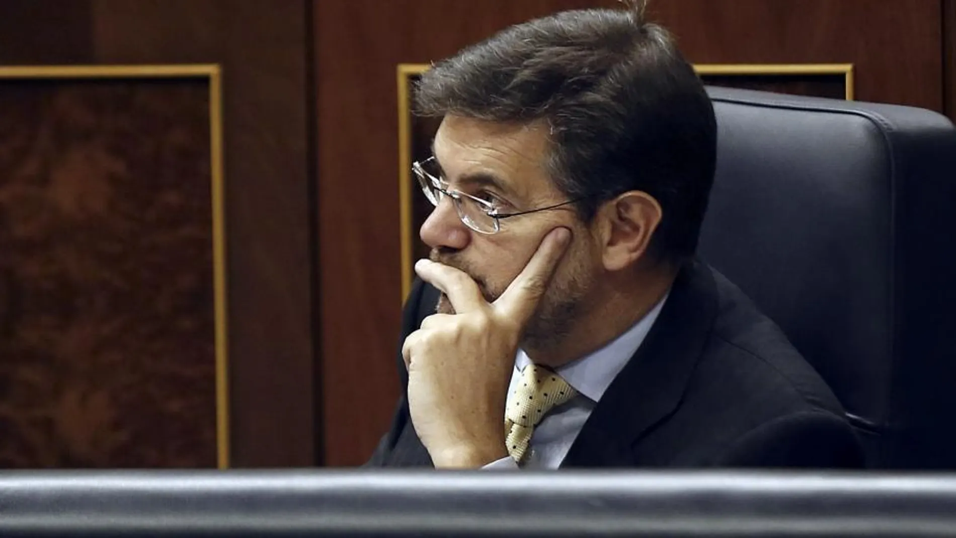 El ministro de Justicia, Rafael Catalá, durante el pleno del Congreso de los Diputados en el que se ha aprobado la reforma del Código Penal que introduce la prisión permanente revisable