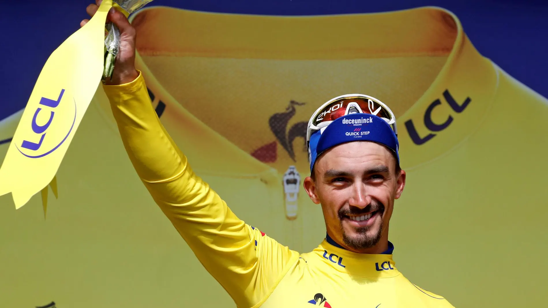 [2019 - Deceuninck-Quick Step rider Julian Alaphilippe of France celebrates on the podium, wearing]
