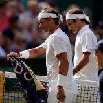 [Wimbledon (United Kingdom), 12/07/2019.- Roger Federer of Switzerland (R) and Rafael Nadal of Spain]