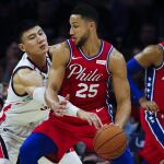 [Philadelphia 76ers' Ben Simmons (25) drives to the net as Guangzhou Loong-Lions' Yongpeng Zhang]