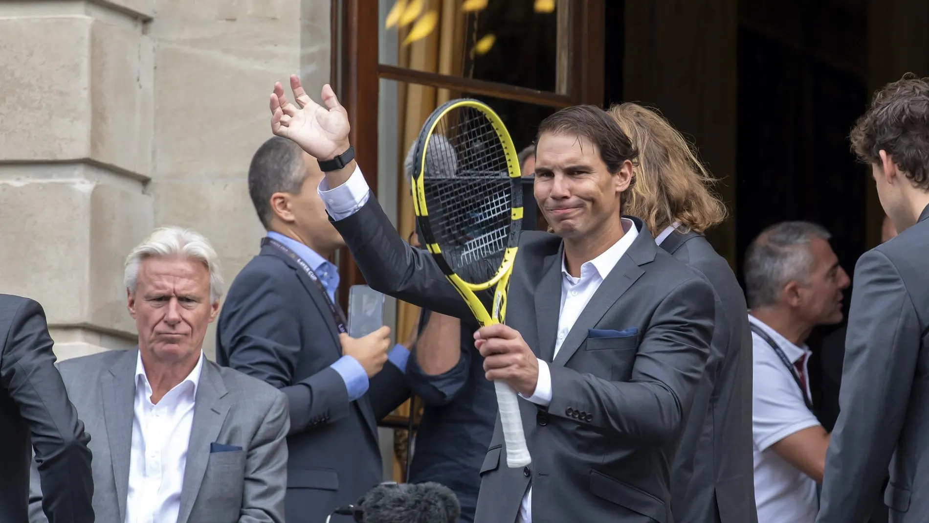 [Borg (L) and Rafael Nadal (R) greet the fans, during the official welcome ceremony together with other]