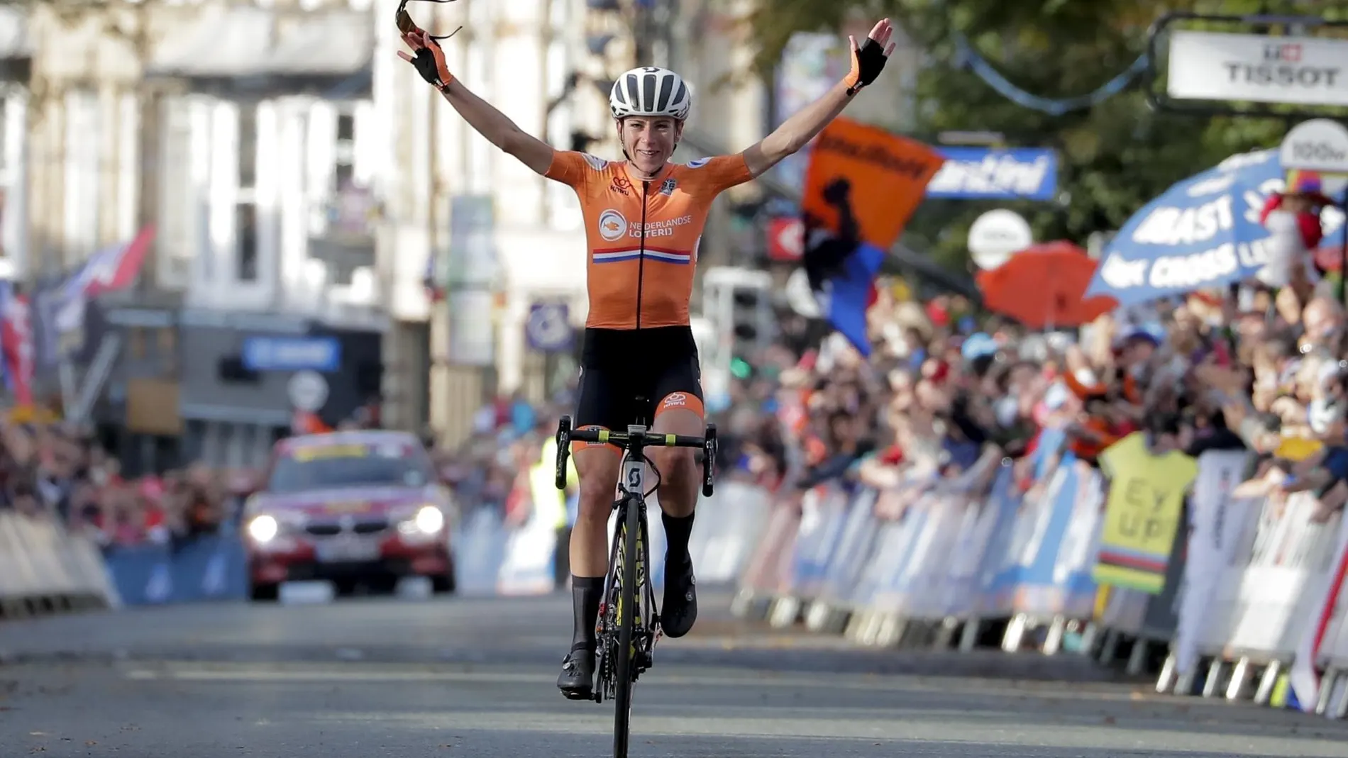 Annemiek van Vleuten, of The Netherlands, celebrates as she crosses the finish line to win the women elite race, at the road cycling World Championships in Harrogate, England, Saturday, Sept. 28, 2019. (AP Photo/Manu Fernandez)