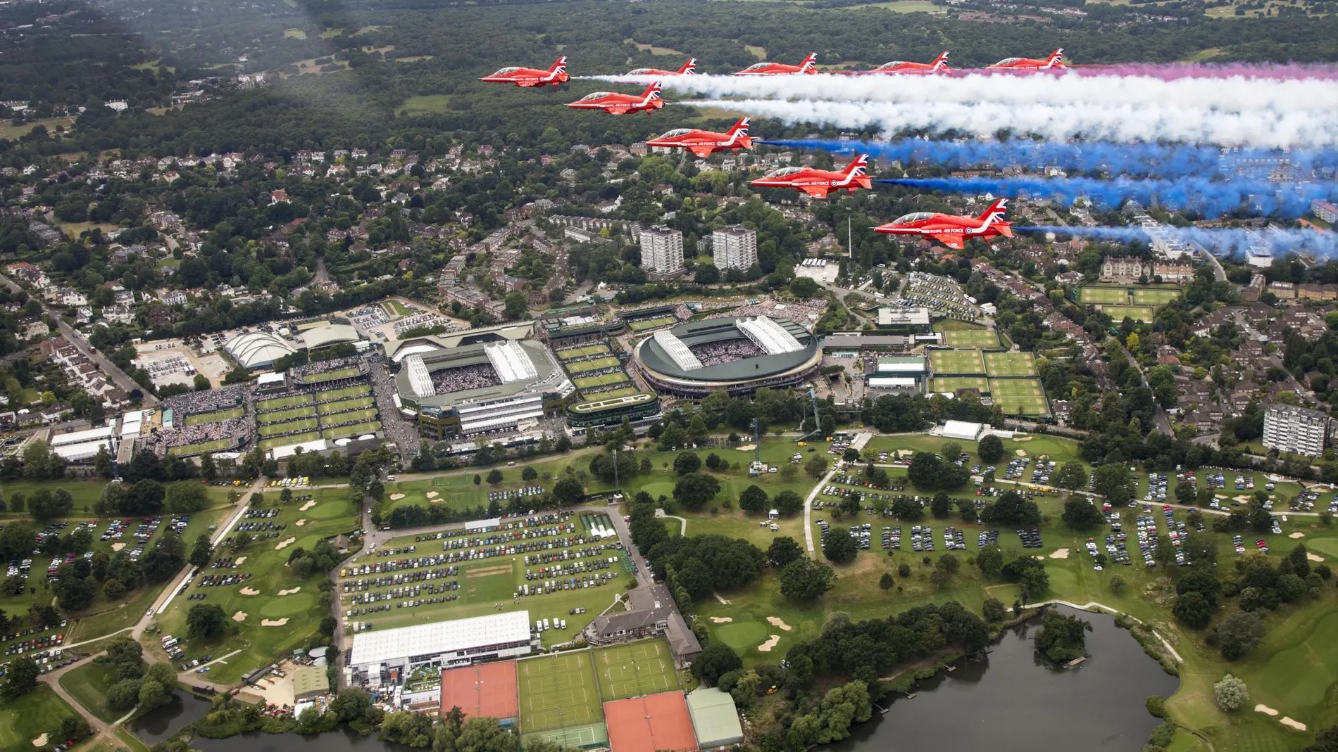 [showing the British Royal Air Force Aerobatic Team, the Red Arrows fly over Wimbledon Tennis Championship]