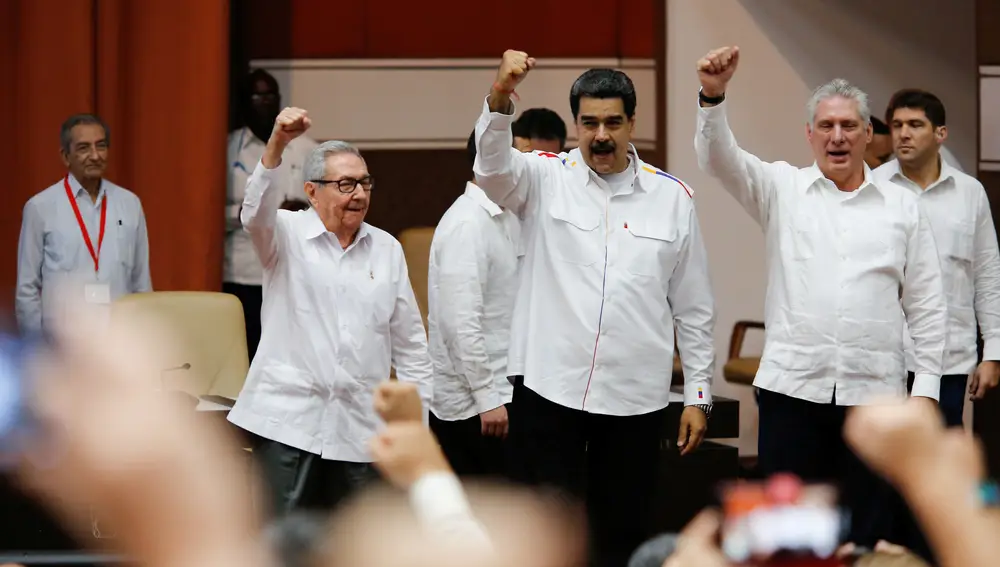 Cuban Communist Party leader and former President Raul Castro, Venezuelan President Nicolas Maduro and Cuba's President Miguel Diaz-Canel take part in a solidarity conference in Havana