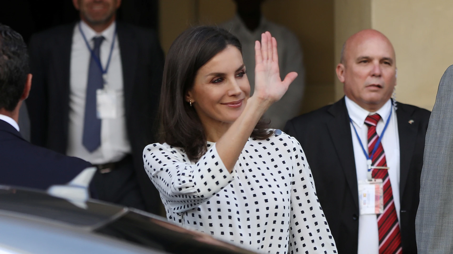 Spain's Queen Letizia waves as she leaves the Bellas Artes Museum in Havana