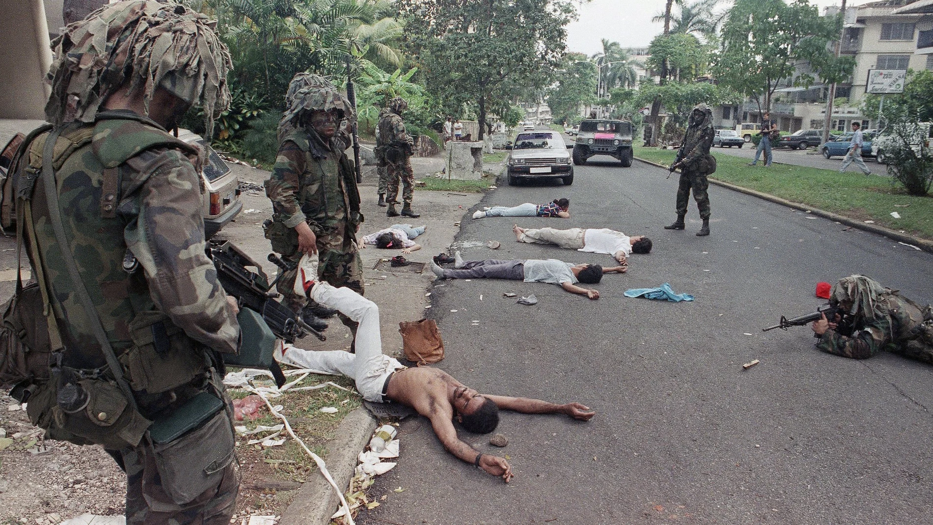 FILE - In this Dec. 26, 1989 file photo, U.S. soldiers take aim while searching suspects detained outside the home of a business associate of Manuel Noriega in Panama City. In 1989, the U.S. invaded Panama to oust strongman Manuel Noriega. (AP Photo/Ezequiel Becerra, File)