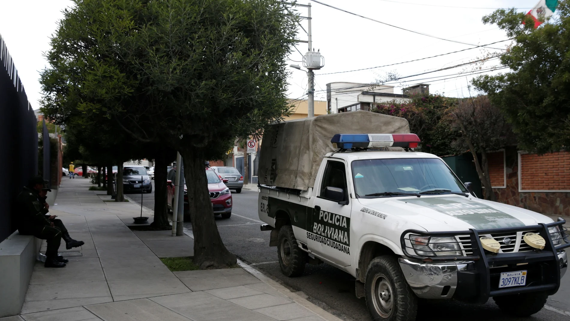 A police patrol vehicle is seen at the entrance of Mexico's embassy in La Paz