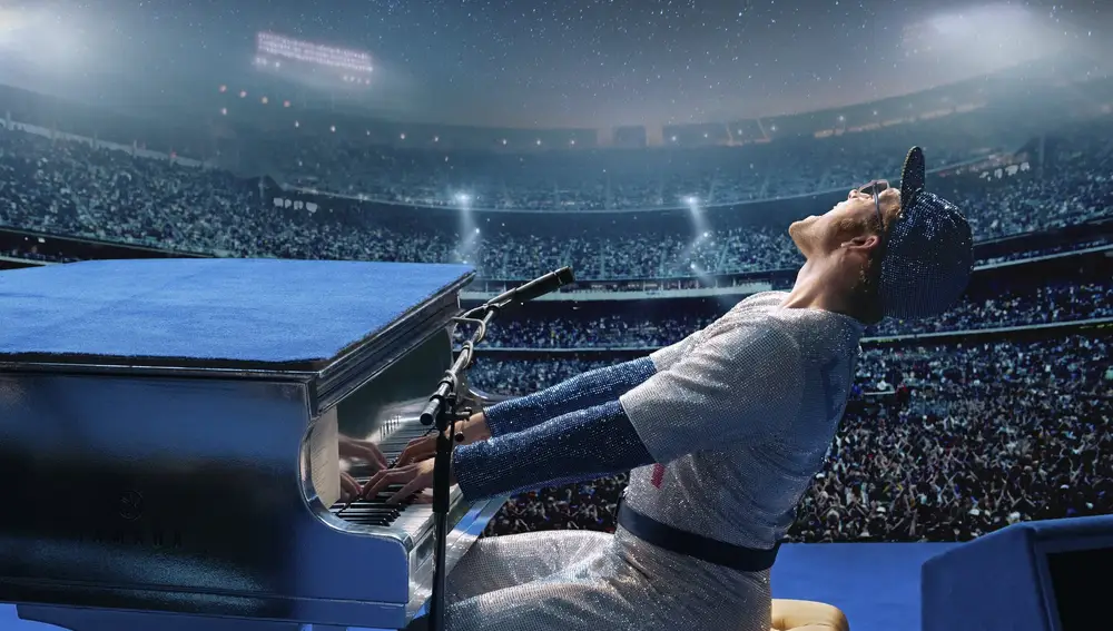 This image released by Paramount Pictures shows Taron Egerton as Elton John in a scene from &quot;Rocketman.&quot; The film was nominated for a Golden Globe for best motion picture comedy. (David Appleby/ Paramount Pictures via AP)