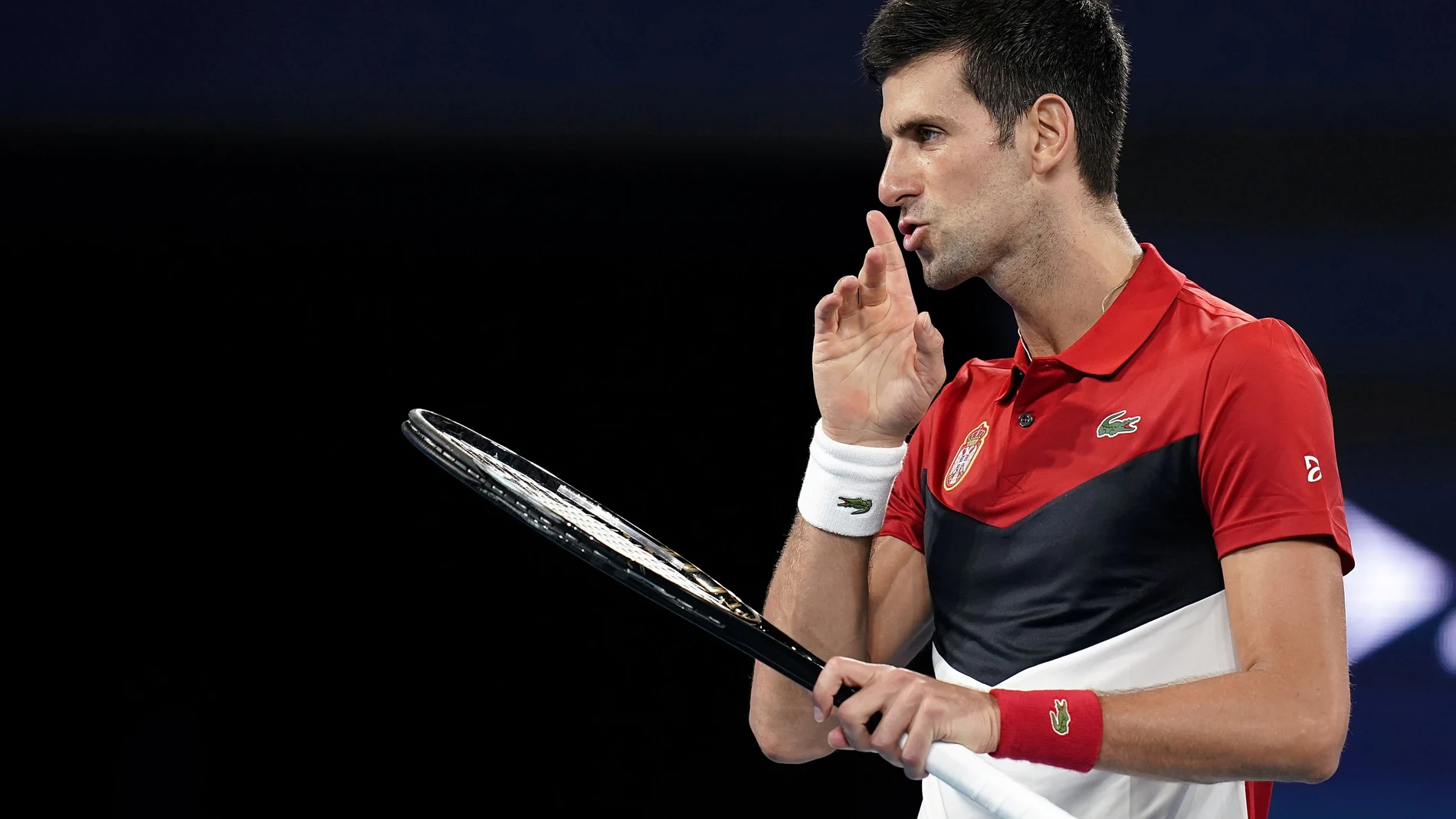 Novak Djokovic of Serbia gestures during his singles match against Kevin Anderson of South Africa on day 2 of the ATP Cup tennis tournament at Pat Rafter Arena in Brisbane