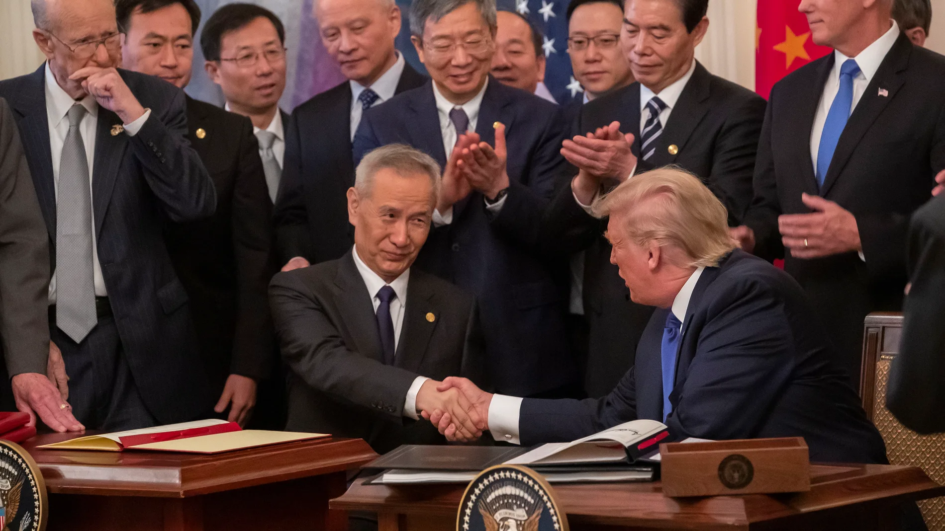 US President Donald J. Trump signs a trade agreement with Chinese Vice Premier Liu He at the White House