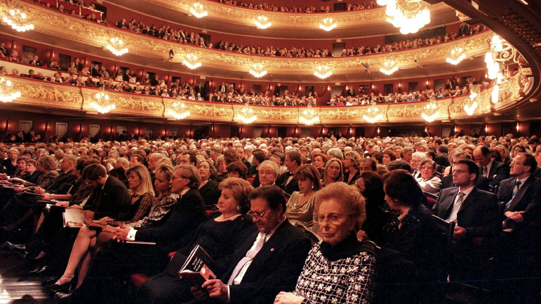 The audience prepares to watch Giacomo Puccini's Turandot opera in the newly rebuilt Liceu Opera House in Barcelona Thursday Oct. 7 1999 that opened its doors for the first time since the January 1994 fire that completely gutted the building. (AP Photo/Pool/Andreu Dalmau/EFE)