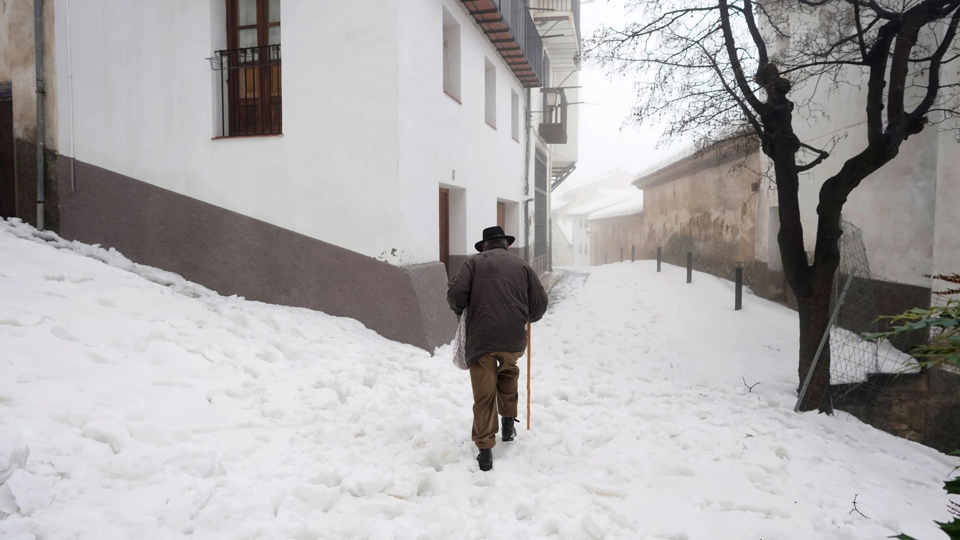 A man walks during the storm "Gloria" in Morella