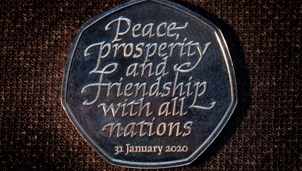 Brexit commemorative 50 pence coin that bears the words &quot;Peace, prosperity and friendship with all nations&quot; is pictured in an unknown location