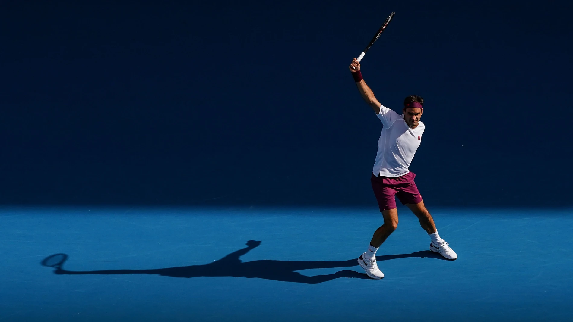 Roger Federer of Switzerland plays a shot during his fifth round match against Tennys Sandgren of the USA on day nine of the Australian Open tennis tournament at Rod Laver Arena in Melbourne, Tuesday, January 28, 2020. (AAP Image/Scott Barbour) NO ARCHIV