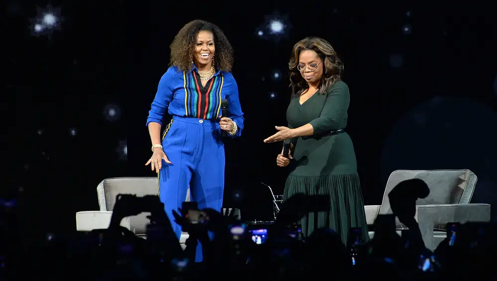 Michelle Obama, left, and Oprah Winfrey participate at &quot;Oprah's 2020 Vision: Your Life in Focus&quot; tour at the Barclays Center on Saturday, Feb. 8, 2020, in New York. (Photo by Brad Barket/Invision/AP)