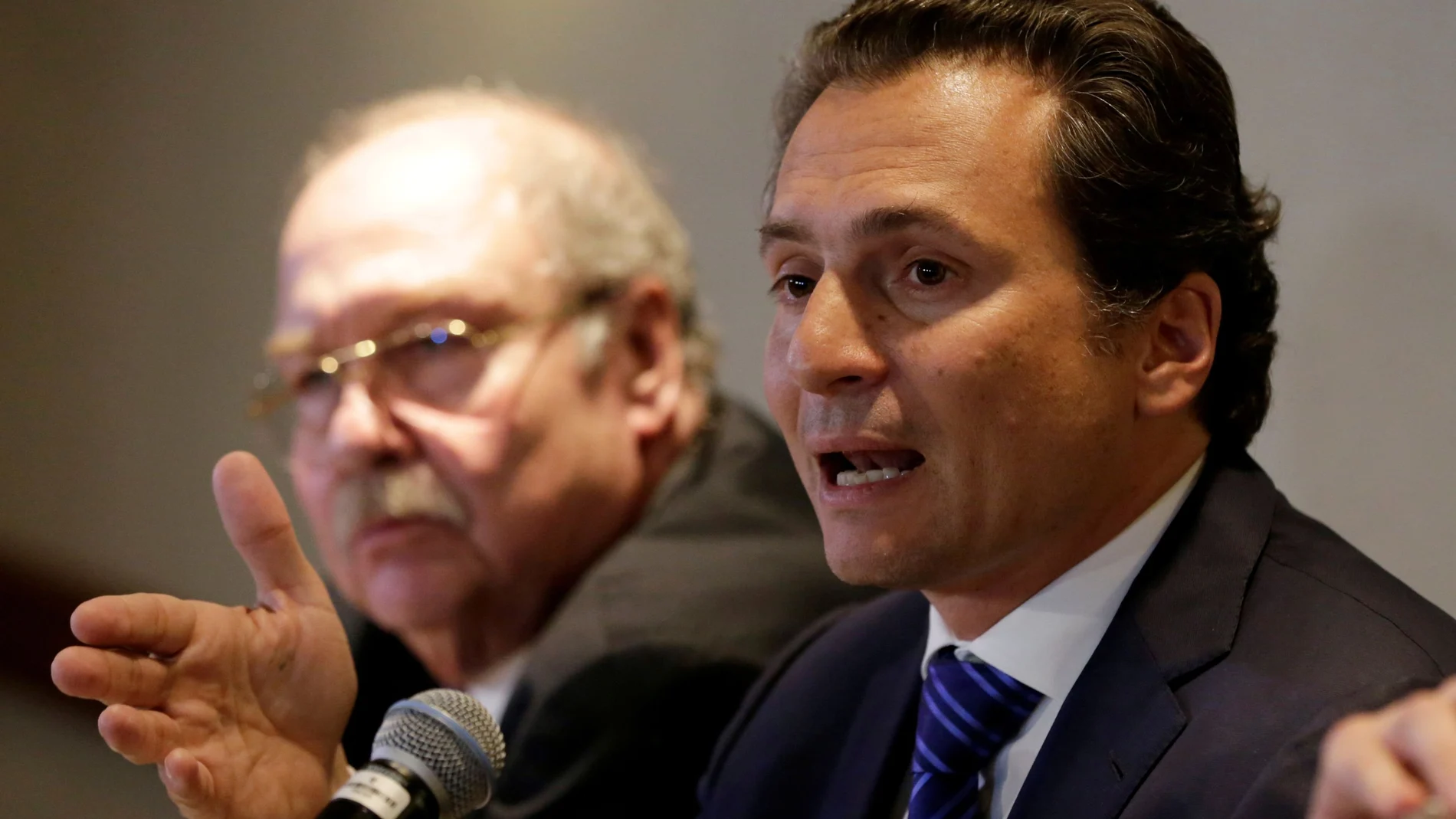 FILE PHOTO: Emilio Lozoya, former chief Executive Officer of Petroleos Mexicanos (Pemex) speaks next to his lawyer Javier Coello Trejo during a news conference at a hotel after he leaves Mexico's attorney general's office, in Mexico City