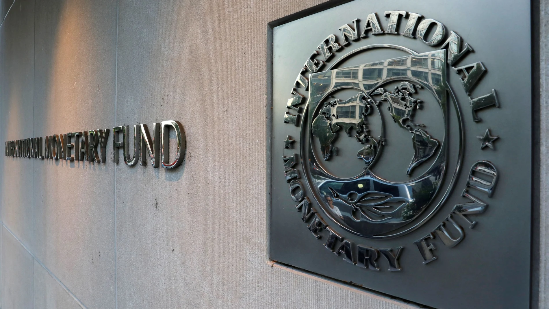FILE PHOTO: IMF logo is seen outside the headquarters building in Washington