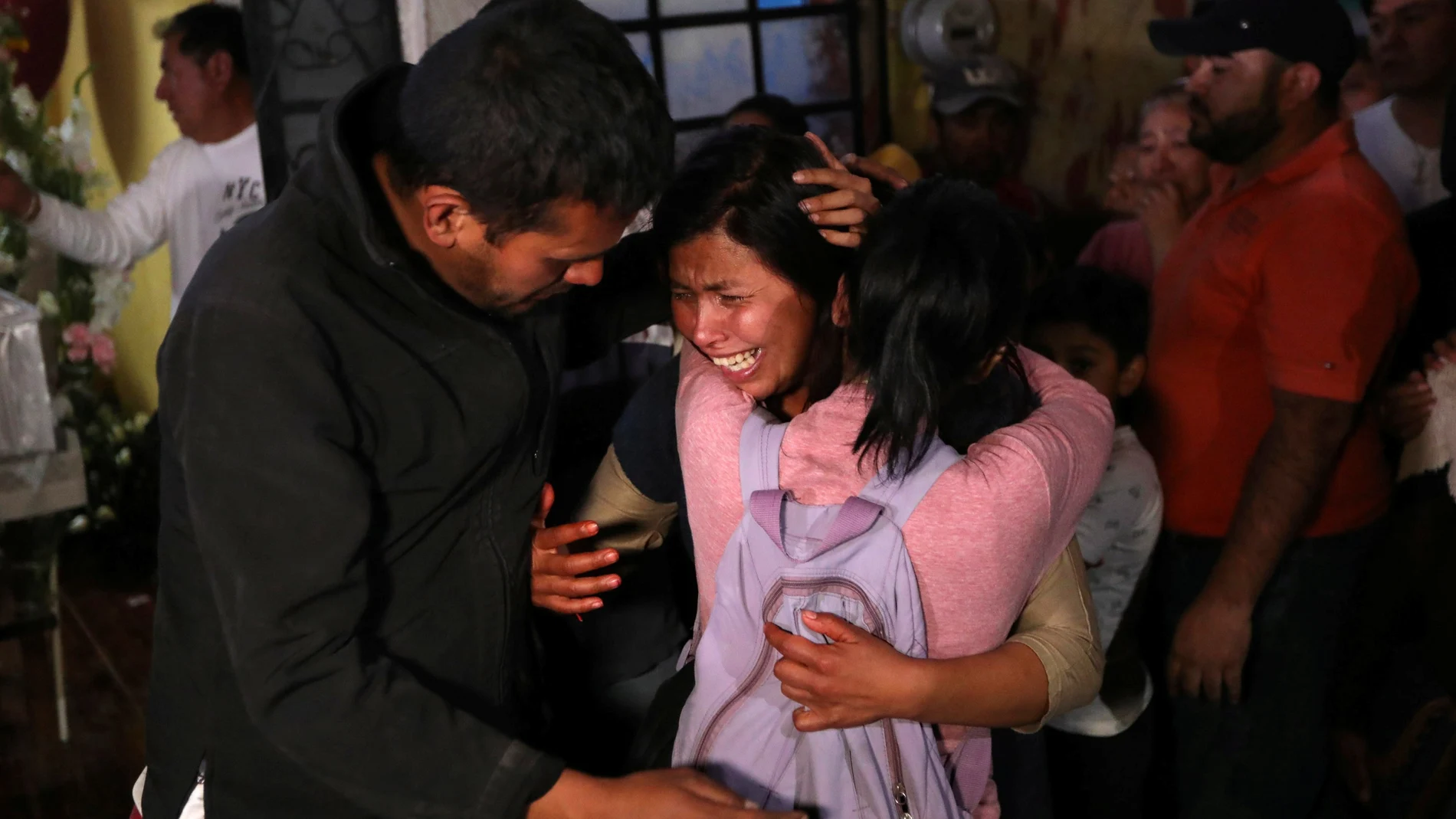Maria Magdalena, mother of Fatima Cecilia Aldrighett, who went missing and whose body was discovered over the weekend inside plastic garbage bag, reacts as Fatima's coffin arrives at their house in Mexico City