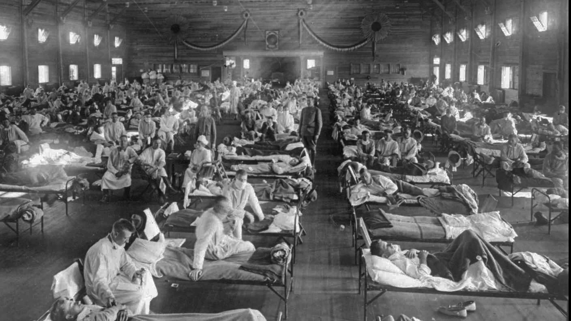 ** FILE ** Influenza victims crowd into an emergency hospital near Fort Riley, Kansas in this 1918 file photo. The 1918 Spanish flu pandemic killed at least 20 million people worldwide and officials say that if the next pandemic resemblers the birdlike 1918 Spanish flu, to 1.9 million Americans could die. (AP Photo/National Museum of Health)