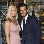 FILE - This Aug. 21, 2019 file photo shows Orlando Bloom, right, a cast member in the Amazon Prime Video series "Carnival Row," with singer Katy Perry, at the premiere of the series in Los Angeles. Perry has revealed she's pregnant at the end of the video for her latest song â€œNever Worn White.â€ The news was confirmed Thursday by Perry's label, Capitol Music Group. The baby will be Perry's first, and the second for her fiance, Orlando Bloom, who has a 9-year-old son, Flynn, with ex-wife Miranda Kerr. (Photo by Chris Pizzello/Invision/AP, File)