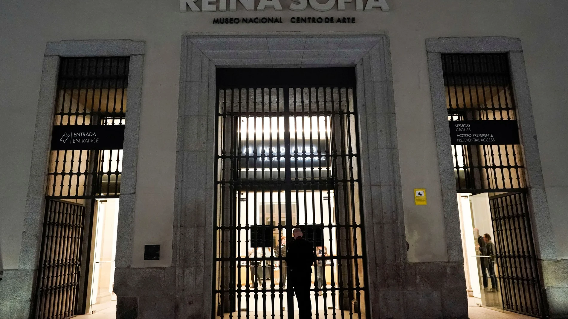 A security guard closes the gate of Reina Sofia museum in Madrid