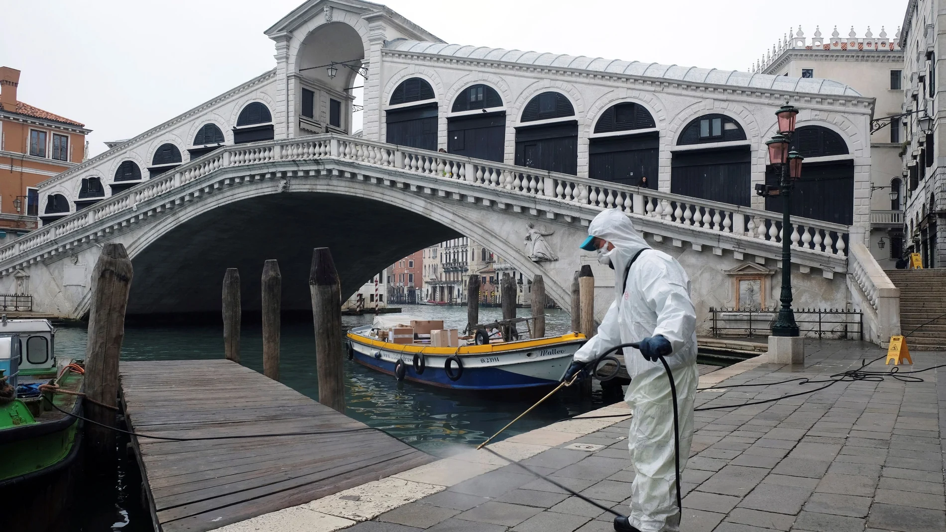 A worker sanitises the Rialto Bridge as a measure against the coronavirus disease (COVID-19) in Venice