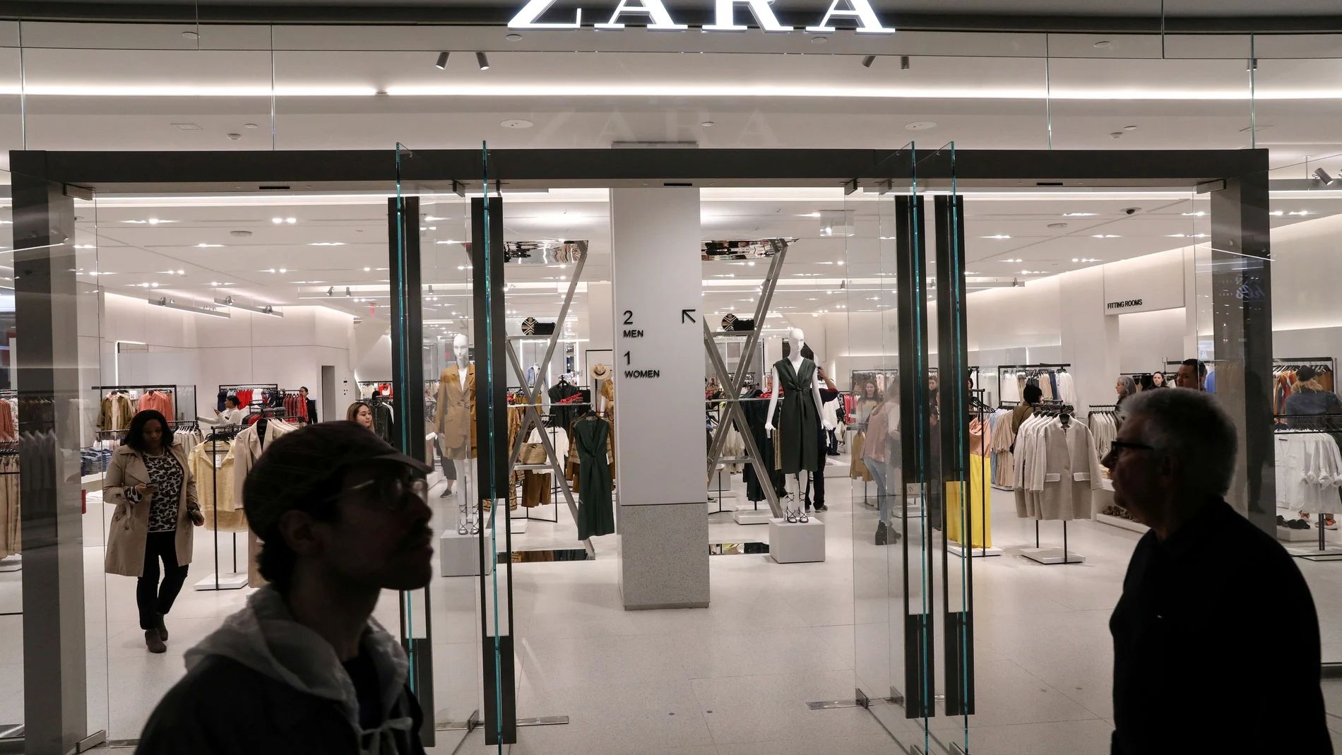 FILE PHOTO: People shop at a Zara store during the grand opening of The Hudson Yards development in New York
