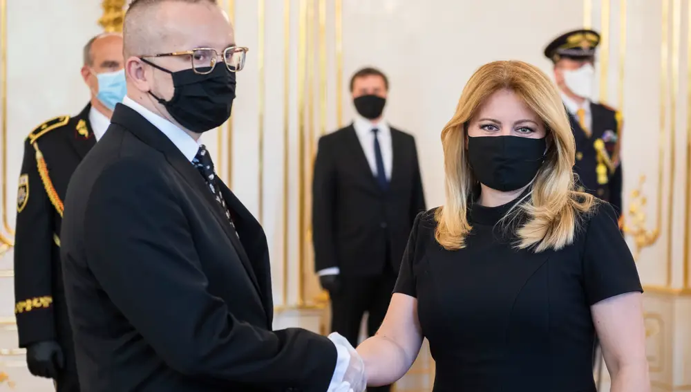 15 April 2020, Slovakia, Bratislava: Slovak President Zuzana Caputova (R) shakes hands with Vladimir Polinski after being appointed as the new Director of the Slovak Information Service (SIS) at the governmental palace. Photo: Jaroslav Novk/TASR/dpa15/04/2020 ONLY FOR USE IN SPAIN
