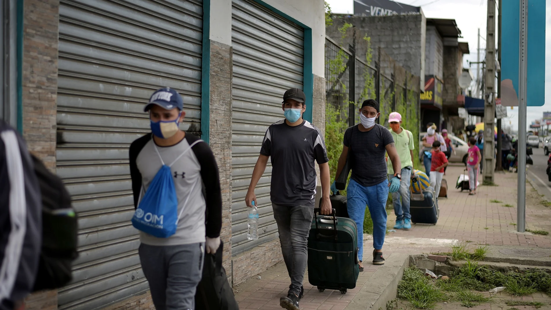 Venezuelan immigrants set off for Venezuela on foot amid the spread of the coronavirus disease (COVID-19), in Duran