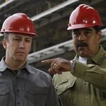 FILE - In this May 19, 2018 file photo, Venezuela's President Nicolas Maduro, right, and Vice President Tareck El Aissami tour La Rinconada baseball stadium that is under construction on the outskirts of Caracas, Venezuela. President Maduro on Monday, April 27, 2020, named El Aissami , a powerful ally sanctioned by the U.S. as a drug kingpin along with a cousin of the late socialist leader Hugo ChÃ¡vez, to revamp Venezuela's oil industry amid massive gasoline shortages. (AP Photo/Ricardo Mazalan, File)