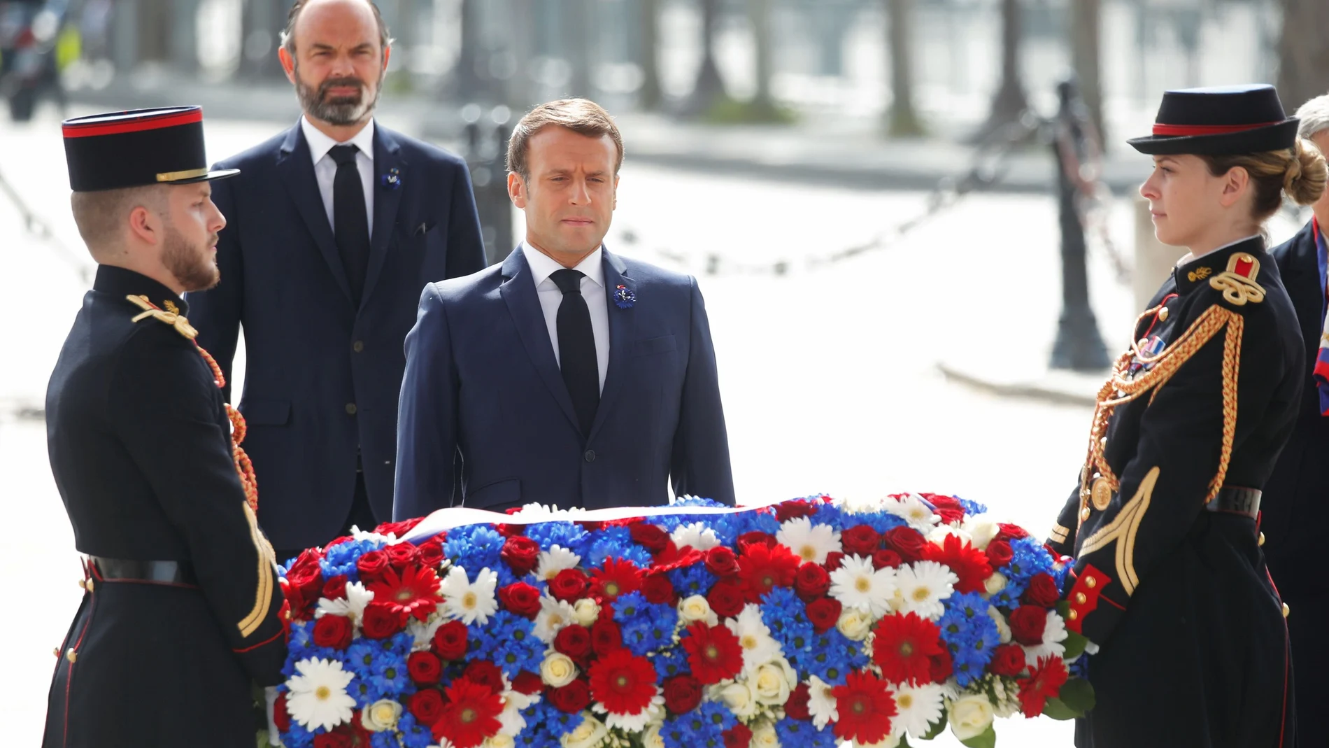 French President Emmanuel Macron attends a ceremony to mark the end of World War II at the Arc de Triomphe in Paris