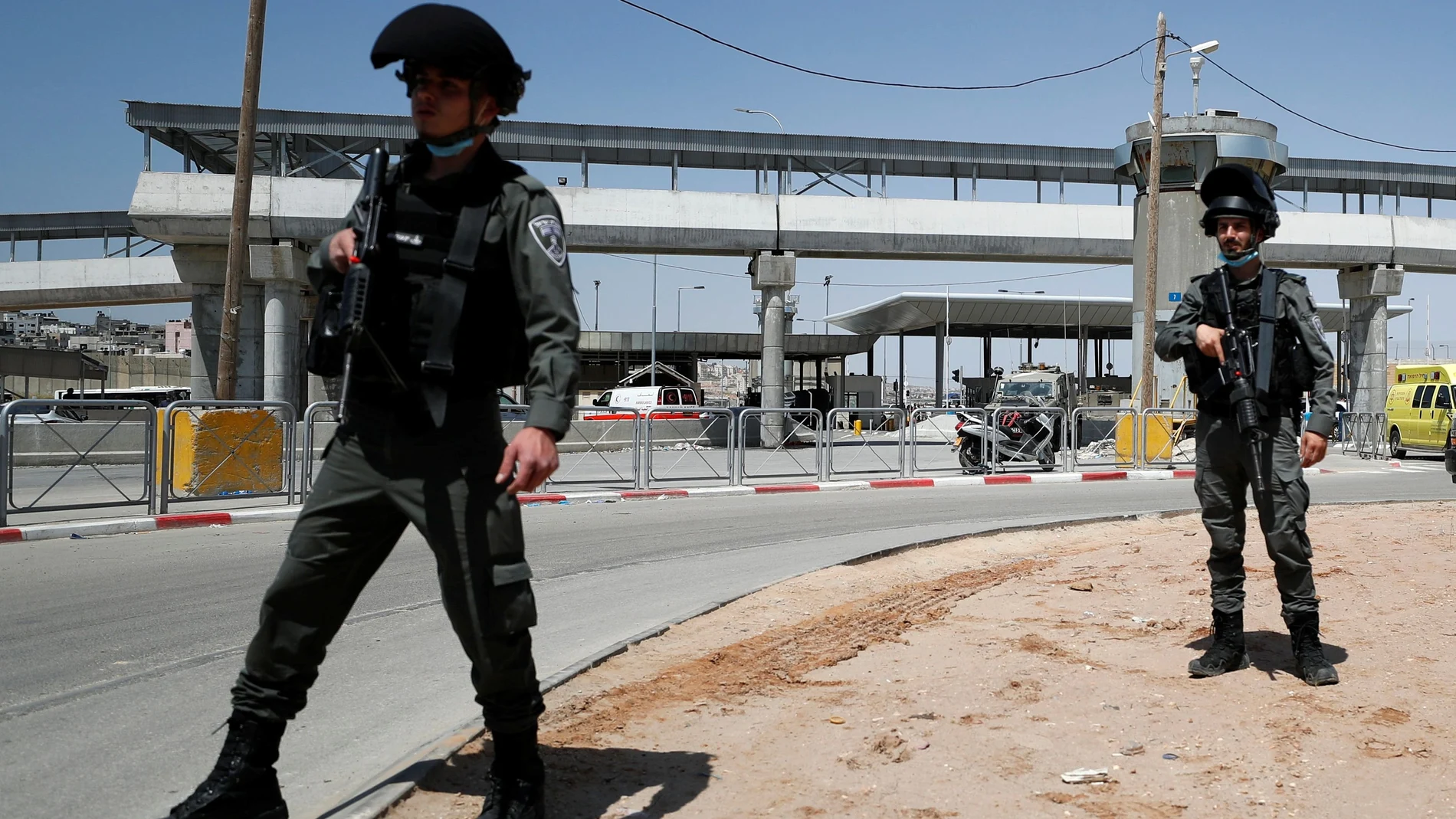 Israeli forces work at the scene of an incident at Qalandia checkpoint in the Israeli-occupied West Bank